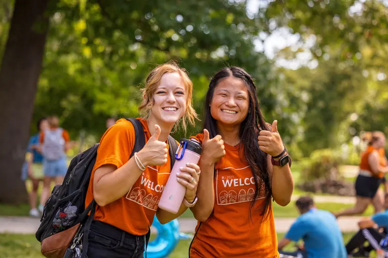 2 Female Students Outside with water bottle