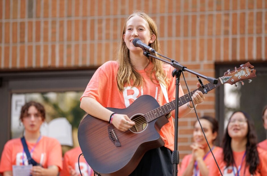 Student Singing with Guitar