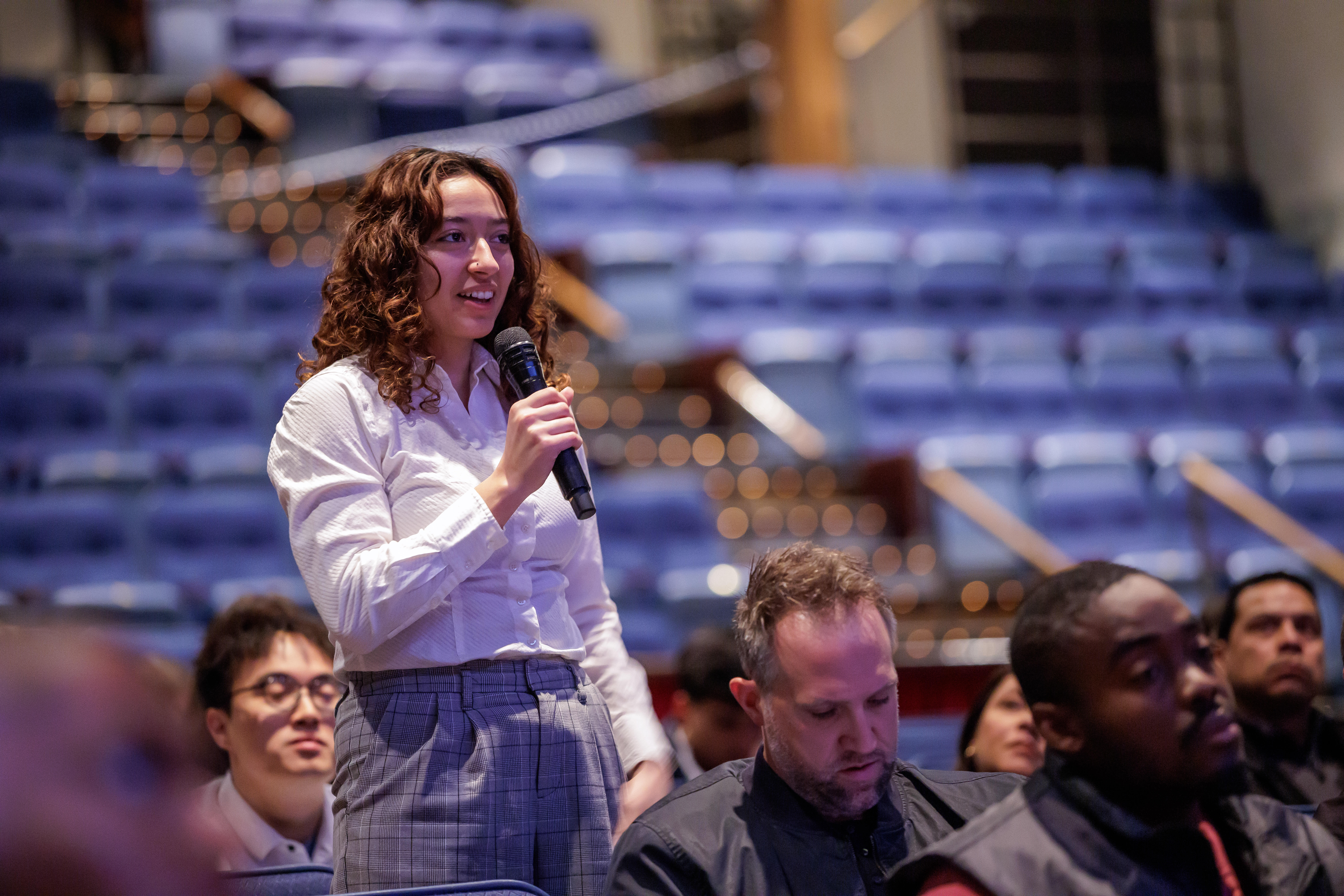 Computer science students looking at a monitor.