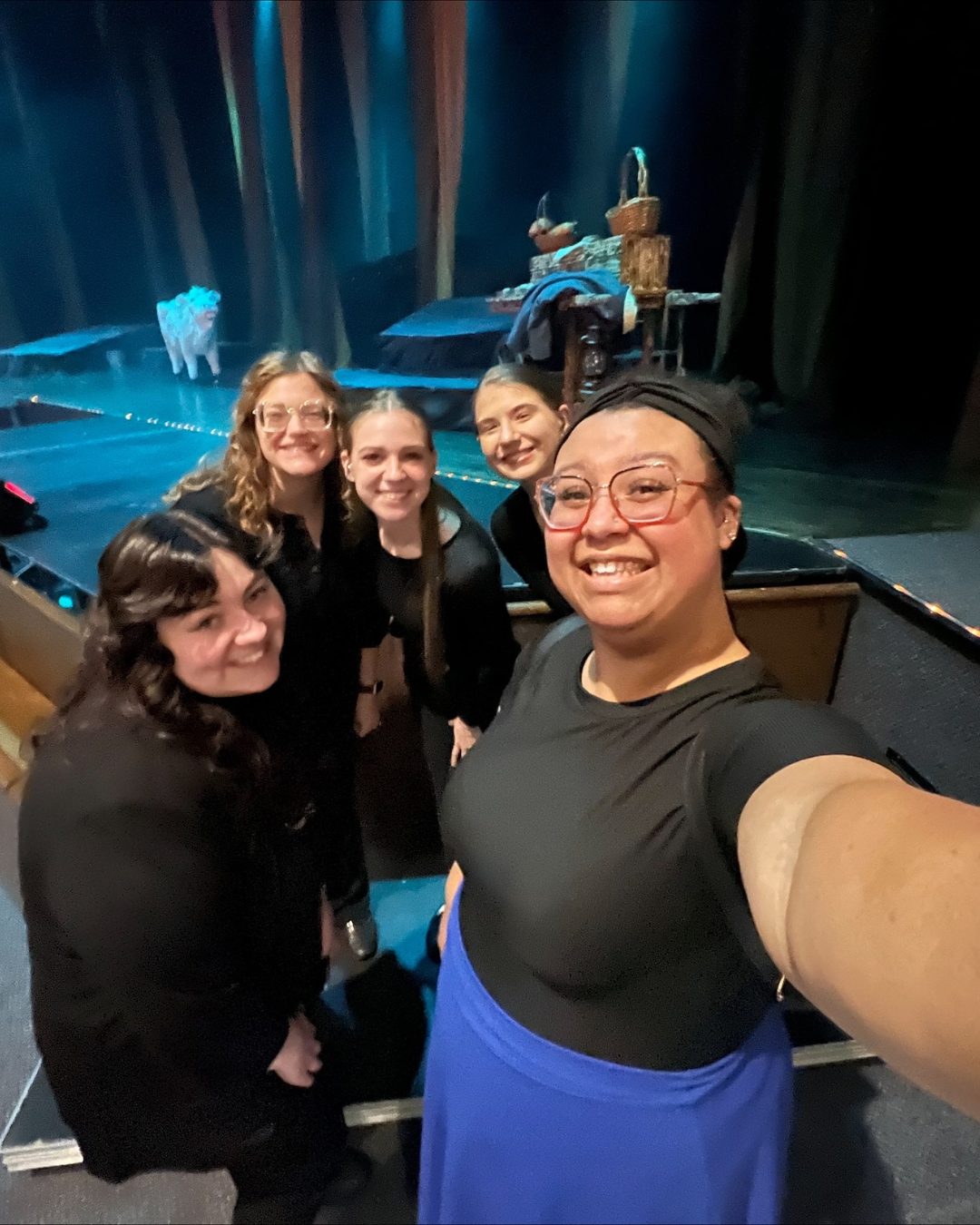 Mondesi taking a selfie with theatre interpreting students in front of stage prepared for "Into The Woods" performance