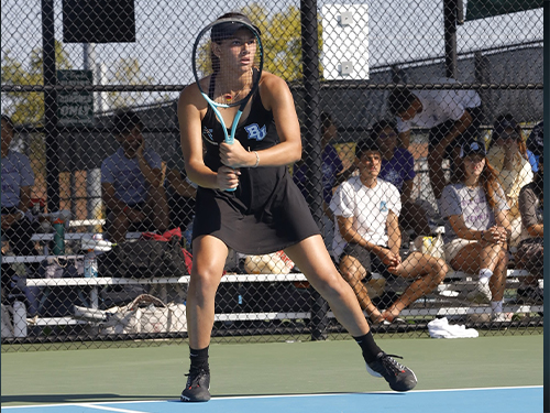 A woman holding a tennis racket