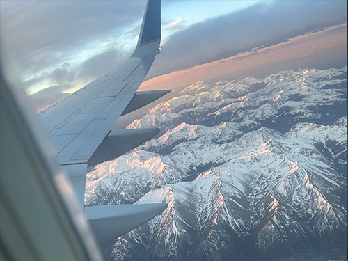 View from a plane overlooking mountains