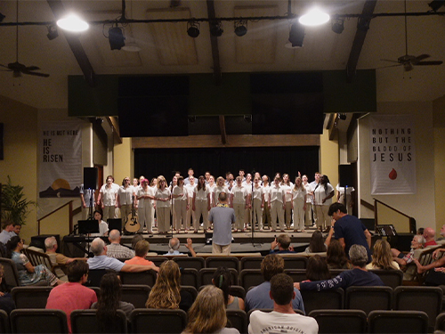 The choir performing in an auditorium