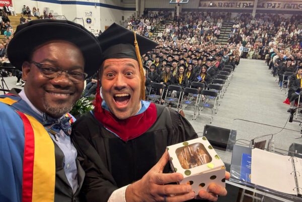 Dr. Abson Joseph and Dr. Keith Koteskey take a selfie during Bethel University commencement after Koteskey was named Professor of the Year.