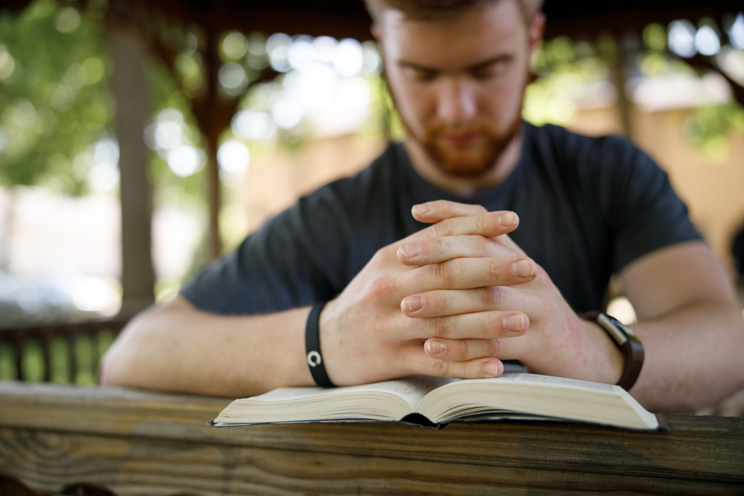 Spiritual Formation student praying with bible